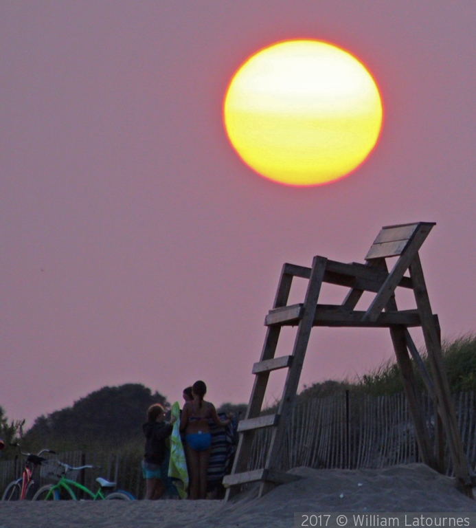 Changing On The Beach At Sunset by William Latournes