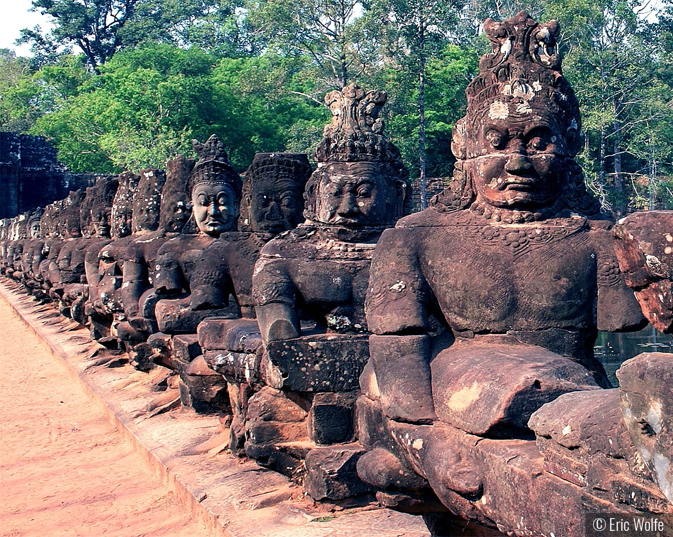 Demon gods at Bayon Temple Gate by Eric Wolfe