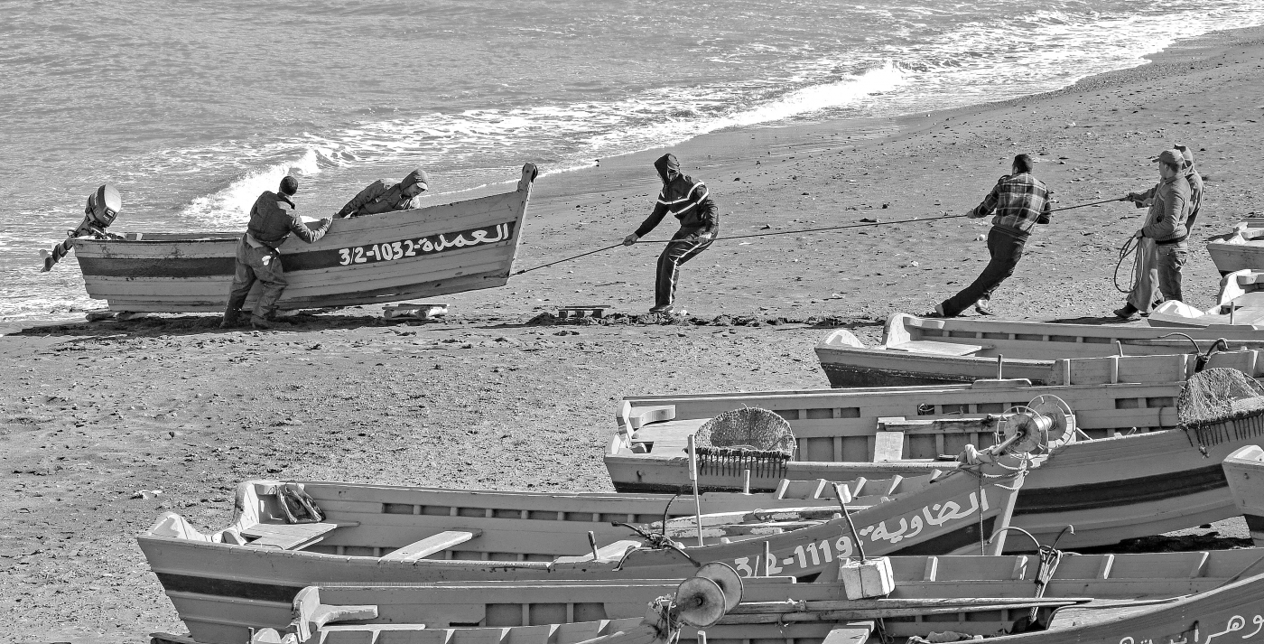 Hauling A Moroccan Fishing Boat Ashore by Louis Arthur Norton