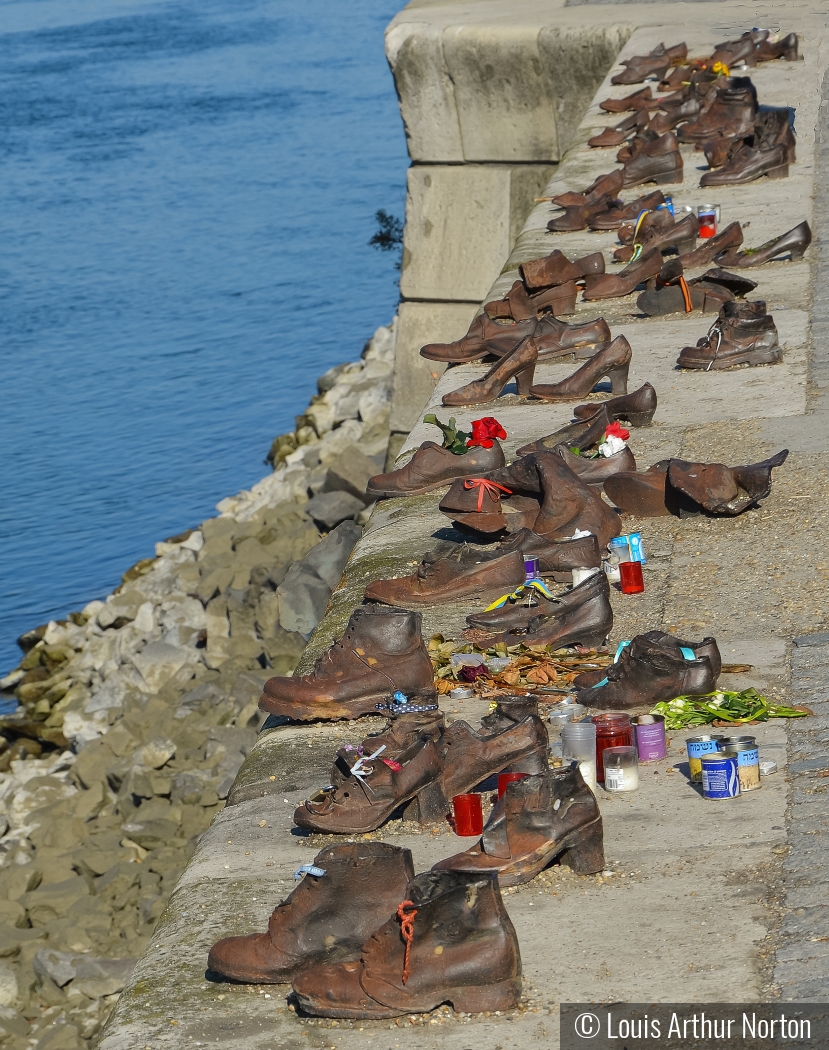 Holocaust Victims's Bronzed Shoes On a Bank Of The Danube by Louis Arthur Norton