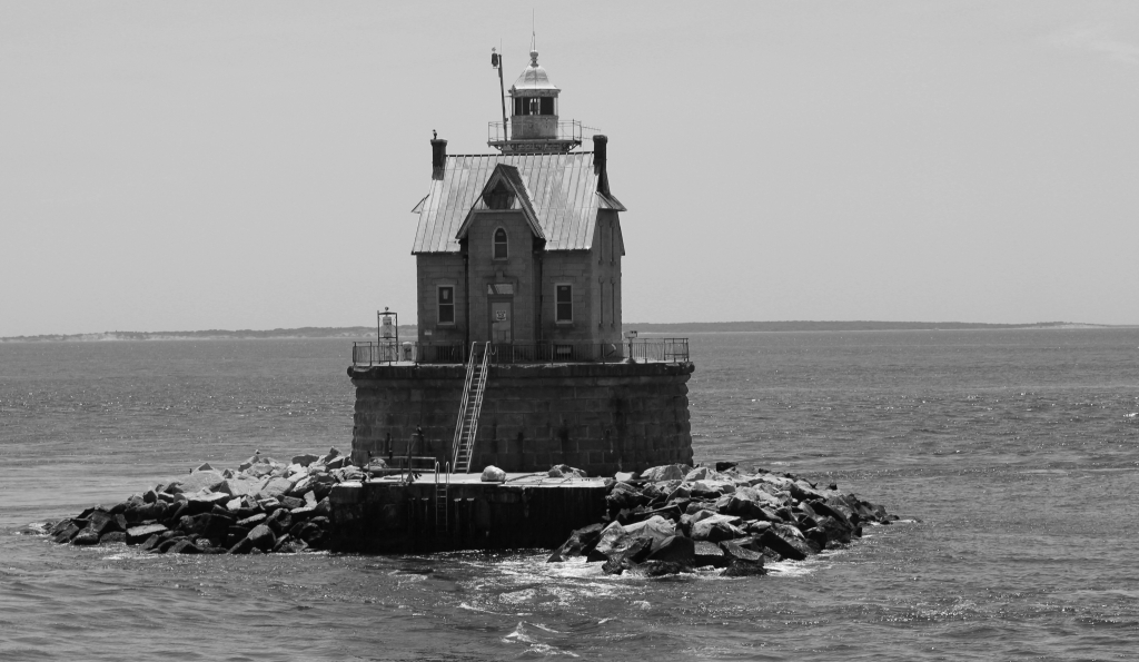 Lighthouse by the sea by Harold Grimes