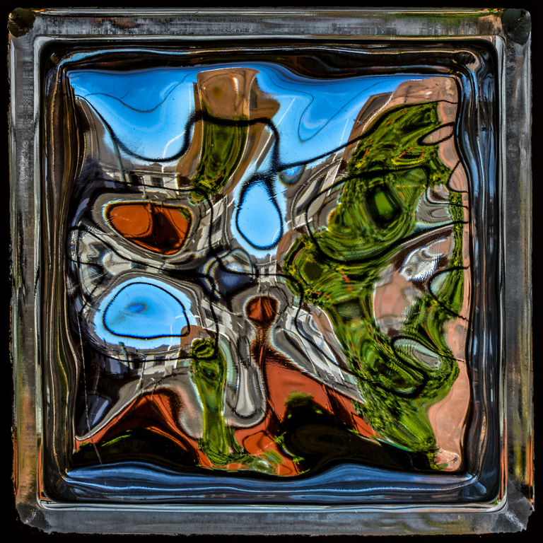 Looking thru a glass block by Frank Zaremba