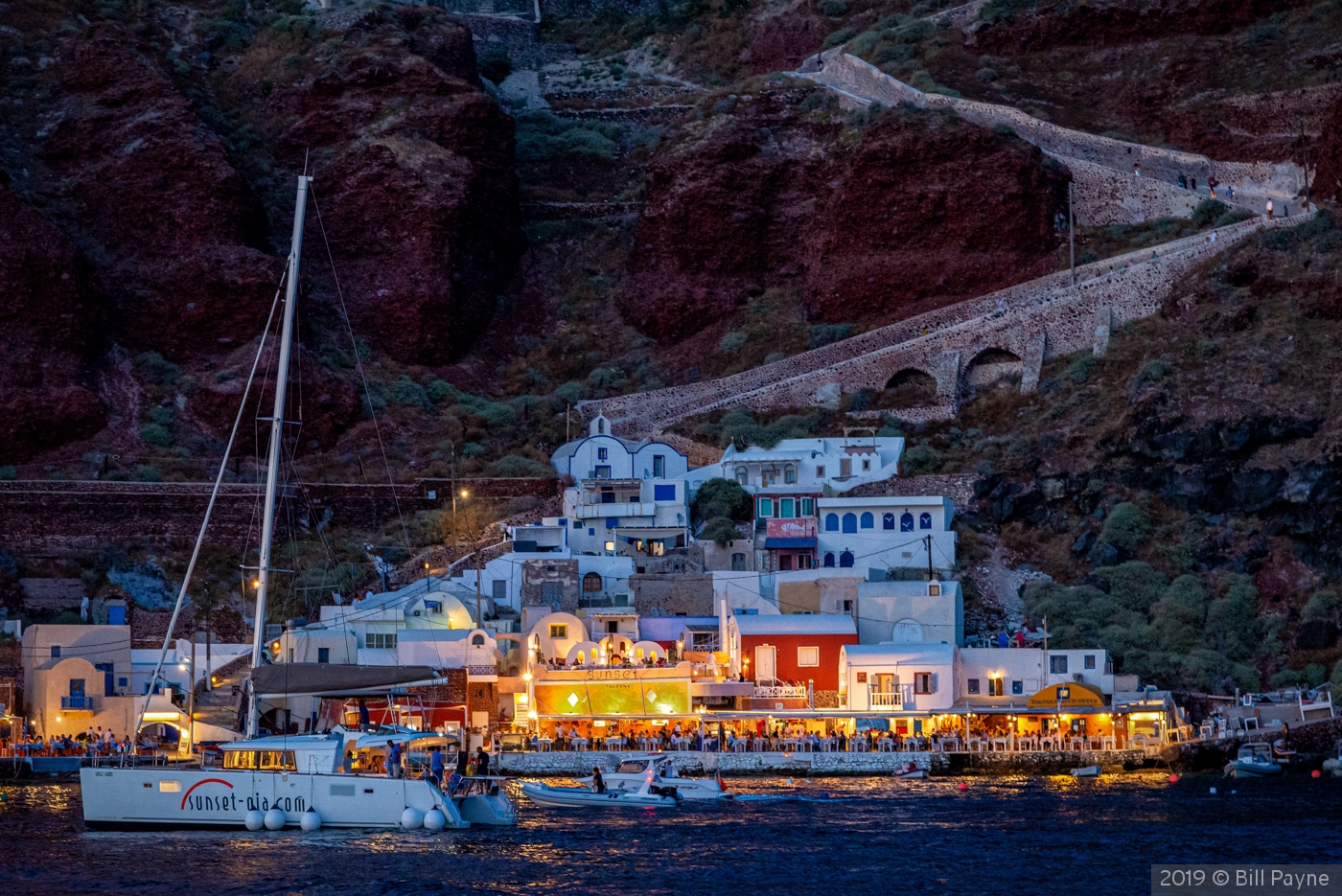 Nearing Santorini after sunset by Bill Payne