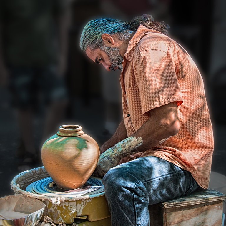 Potter With Blue Clay Hair by Dolph Fusco