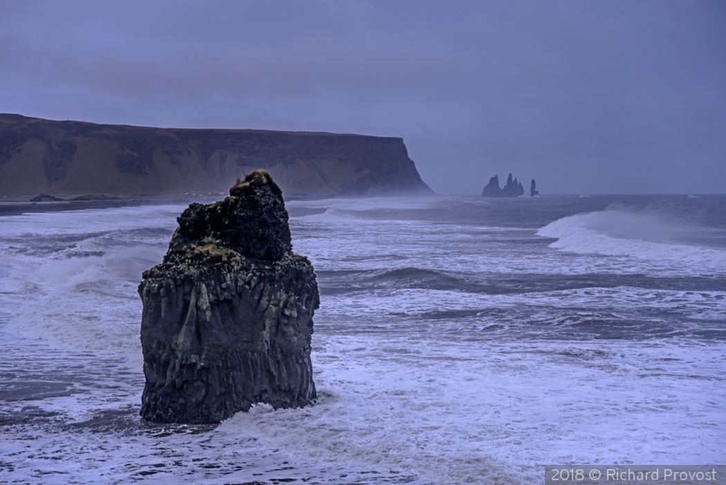 Reynisdranger Sea Stacks in the mist by Richard Provost