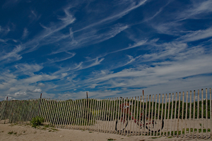 Bicycle on the Fence at the Beach - Photo by Bill Latournes