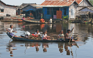 Cambodian Lake-children Paddle To School - Photo by Louis Arthur Norton