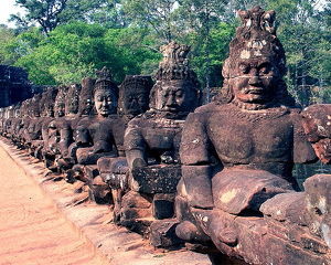 Demon gods at Bayon Temple Gate - Photo by Eric Wolfe