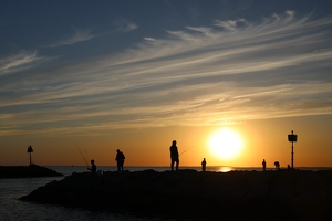 Fisherman At Sunset by Bill Latournes