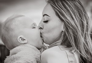 Giving Mommy kisses - Photo by Terri-Ann Snediker