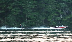 Water skier on a calm lake - Photo by Mireille Neumann