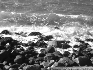 Waves breaking on the rocks on a cold day in January - Photo by Chip Neumann